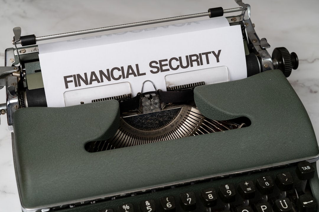 a-close-up-of-a-typewriter-with-a-financial-security-sign-on-it-jxaxmusuwsq
